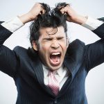 Man pulling his hair out